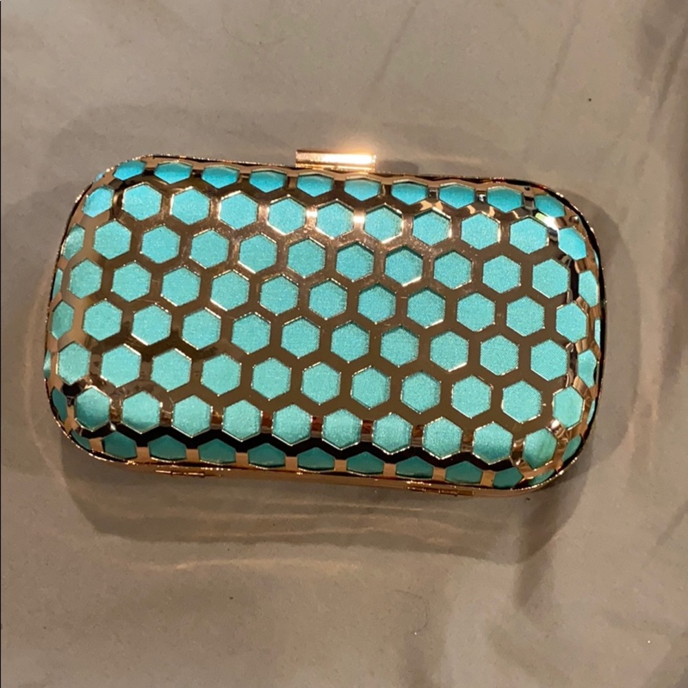 Rose gold clutch with metal strap